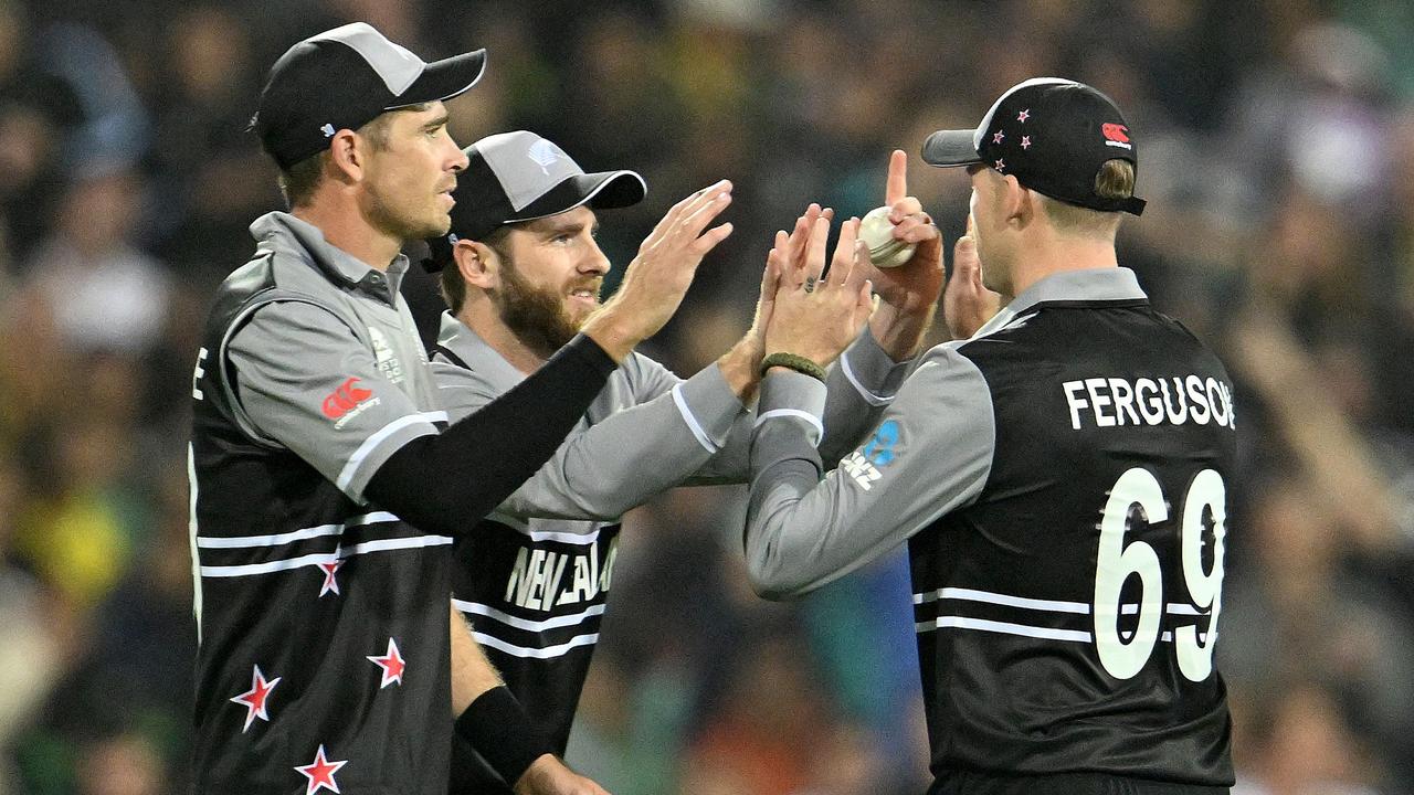 New Zealand’s players celebrate the wicket of Australian captain Aaron Finch. Picture: AFP