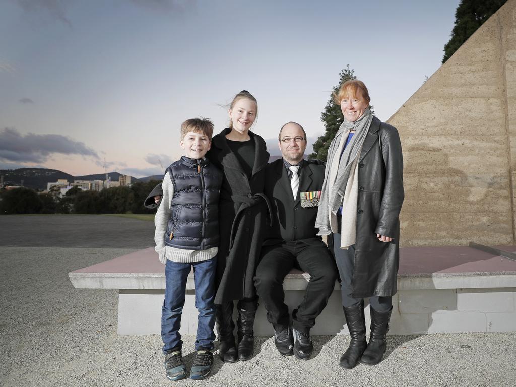 Damian and Alison Fitzallen with their children Estella, 12, and Elias, 9, at the Anzac Day dawn service at the Hobart cenotaph. Picture: PATRICK GEE