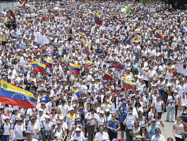 Venezuelan opposition activists take part in a women’s march aimed to keep pressure on President Nicolas Maduro. Picture: Federico Parra/AFP