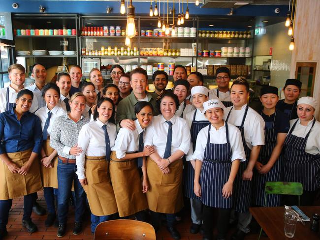 Jamie Oliver with the staff and kitchen crew at Jamie’s Italian Parramatta. Picture: Phil Rogers