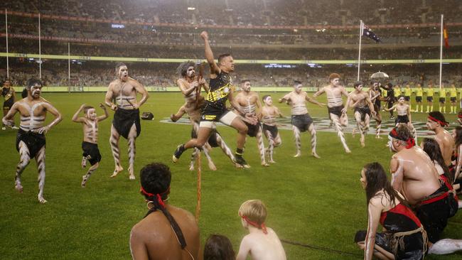 A fearsom Stack leaps in the air, as if wielding a spear. Picture: AFL Photos/Getty Images