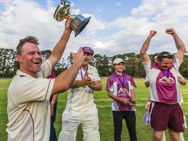 Red Hill captain-coach Simon Dart hoists the premiership cup in 2017. Picture: Valeriu Campan