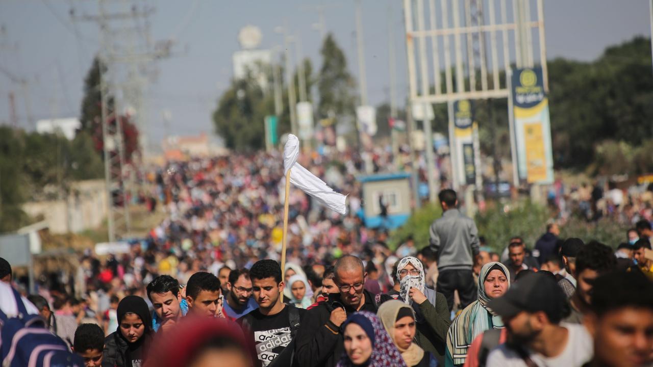 Palestinian citizens displaced from Gaza City to the southern Gaza Strip on Salah al-Din Street in the Al-Mughraqa area on November 10. Picture: Getty