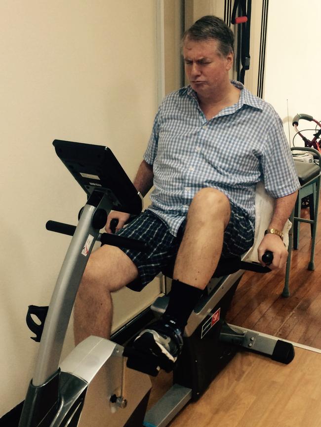 Working hard on the rehab bike to get legs working again.