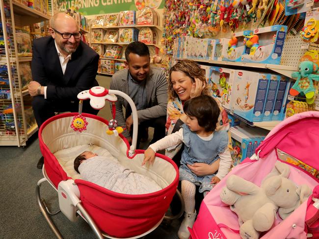 07/09/2018:  Baby Bunting CEO Matt Spencer (left) inside the East Bentleigh store with Jaime & Louise Easaw & their kids Isabelle (2.5y) & Maya (2weeks).  Stuart McEvoy/ The Australian.