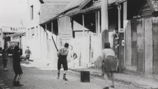 Children play in a Richmond backstreet. Picture: F. Oswald Barnett collection, State Library of Victoria