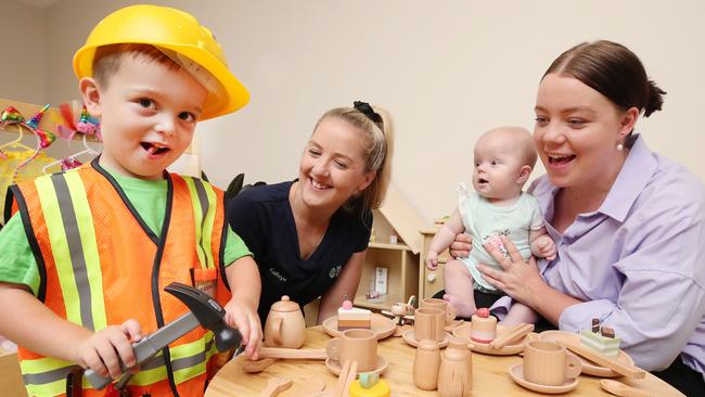 4 year old Hudson Lamb shows off his skills to Centre Director Kathryn Watson, sister Remi Lamb (5 months) and mother Bella Lamb at Edge Early Learning Centre at Pimpama Village. Picture Glenn Hampson