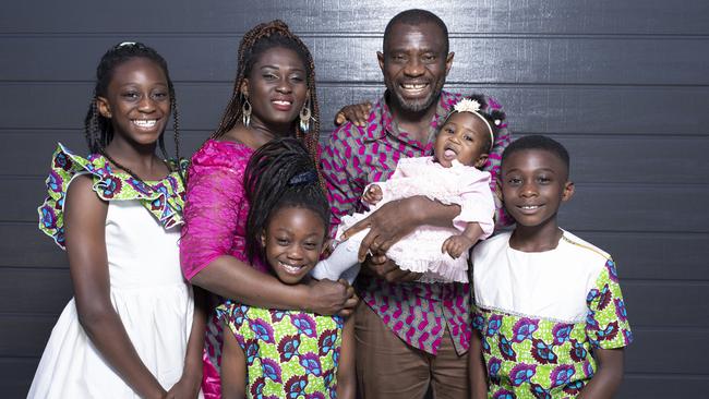 TasWeekend. Cover story with Tasmanian Australian of the Year 2023. John Kamara. John with family L-R Jonievis 11, wife Mavis Quansah-Kamara with baby Joneva 7 months, John-Zion 9, Jonavia 6. Picture: Eddie Safarik