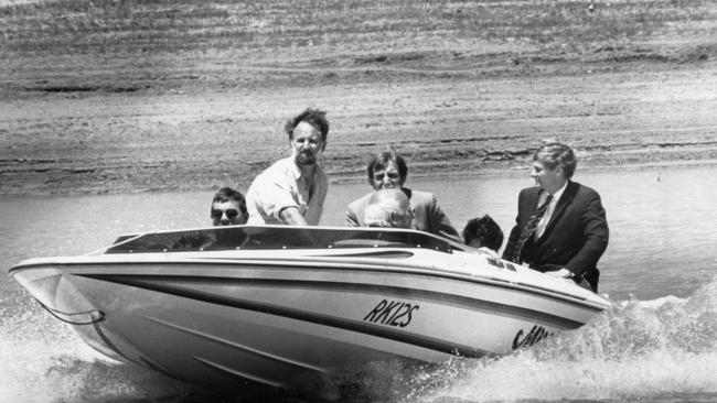 SA Premier John Bannon opens stage II of the Jane Eliza River Estate at Renmark. Premier Bannon on a boat tour with project manager Hague Showell (l) and others, 19 Nov 1989.