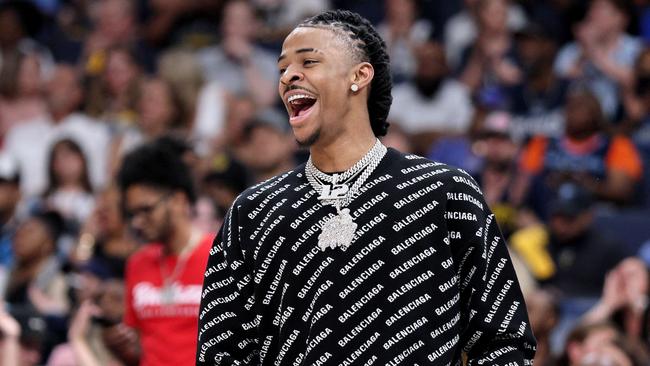 MEMPHIS, TENNESSEE - MAY 11: Ja Morant #12 of the Memphis Grizzlies reacts from the bench against the Golden State Warriors during the fourth quarter in Game Five of the 2022 NBA Playoffs Western Conference Semifinals at FedExForum on May 11, 2022 in Memphis, Tennessee. NOTE TO USER: User expressly acknowledges and agrees that, by downloading and/or using this photograph, User is consenting to the terms and conditions of the Getty Images License Agreement.   Andy Lyons/Getty Images/AFP == FOR NEWSPAPERS, INTERNET, TELCOS & TELEVISION USE ONLY ==