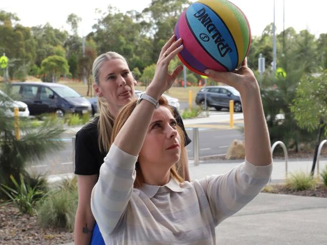 Federal sport minister Anika Wells takes a shot under the watchful eye of Aussie hoops legend Lauren Jackson. Picture: Instagram