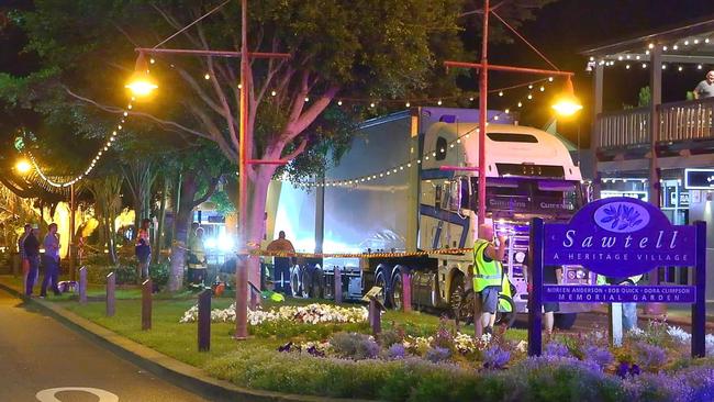 Always on the spot, Frank Redward captured this moment when a B-double truck came to grief in the main street of Sawtell late at night.