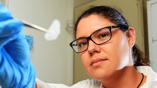 FILE: Police Forensic Science Branch member Kelsey McGorman examines the drug "Ice" in the Forensics laboratory.