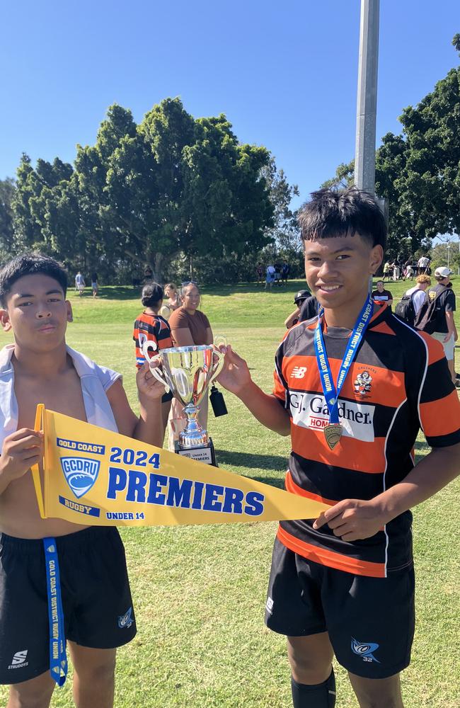 Commer Crushers players Elias Satema and Tyler Lama celebrate their side's under-14 GCDRU grand final win.