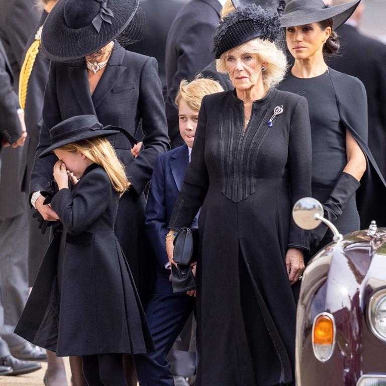 Charlotte was comforted by her mother, the Princess of Wales (Photo by Phil Harris / POOL / AFP)