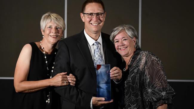 Dr Richard Harris SC OAM, flanked by his sisters Amanda Pryor and Christina Turner at the South Australian of the Year awards. Picture: Bianca De Marchi