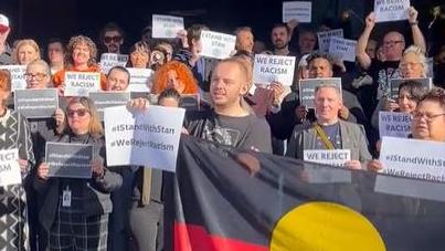 Staff pictured outside ABC headquarters in support of Stan Grant.