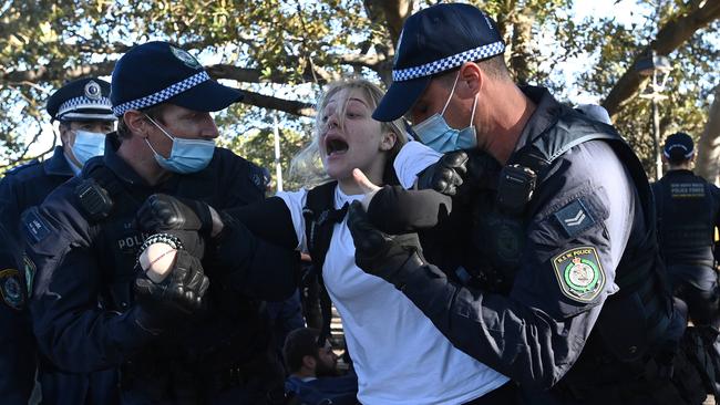 A women being led away by police. Picture: NCA NewsWire/Bianca De Marchi