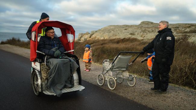 Morgan Simonsson cycles with his step-dad, Ingvar Kristiansson, on a ride they take once per week to help break Ingvar's isolation during the pandemic in Gothenburg, Sweden. Marie is part of Cycling Without Age project, which offers free bike rides to seniors on an electric trishaw. Picture: Getty Images