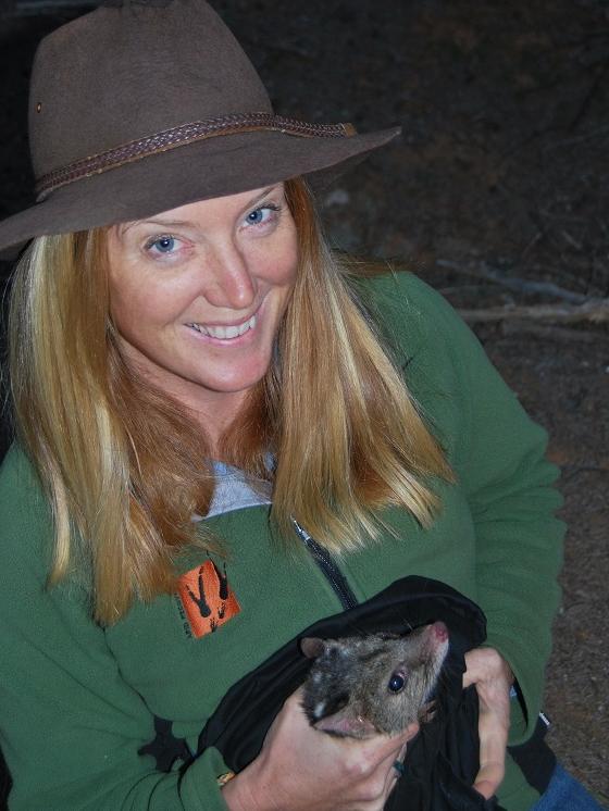 Dr Katherine Moseby with a quoll. Picture: Daniel Clarke, Ninti Media