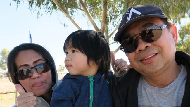 August, Maria and Marco say they've come to Finke every years since 2012. Originally from the the Philippines, they say they're a big fan of the car category. Picture: Gera Kazakov