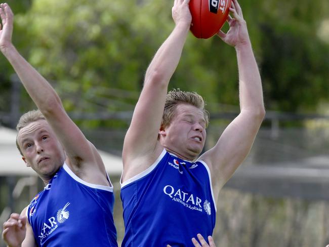 10/4/21 - Adelaide Footy League - St Peter's Old Collegians v Adelaide University at Caterer Oval in St Peters - SPOC's #7 James Duncan goes for a mark. Picture: Naomi Jellicoe