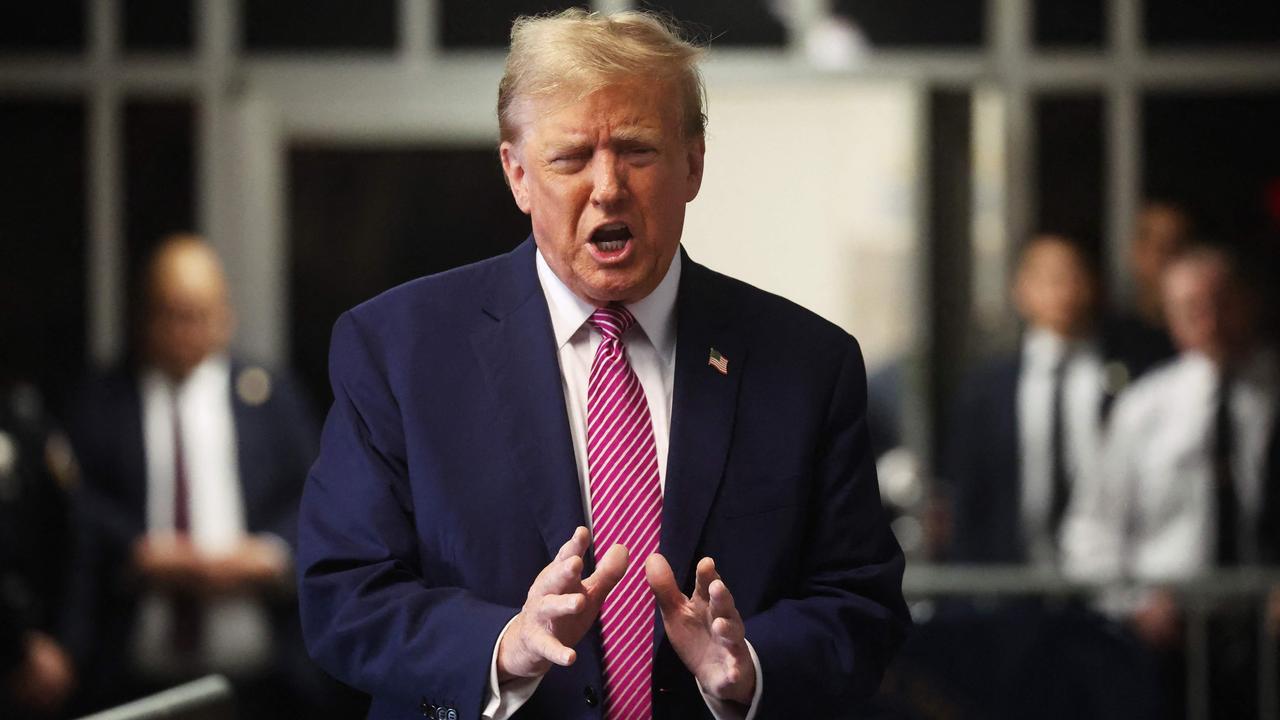 Former US President Donald Trump speaks to the press before entering the courtroom several hours before the man self-immolated. (Photo by Spencer Platt / POOL / AFP)