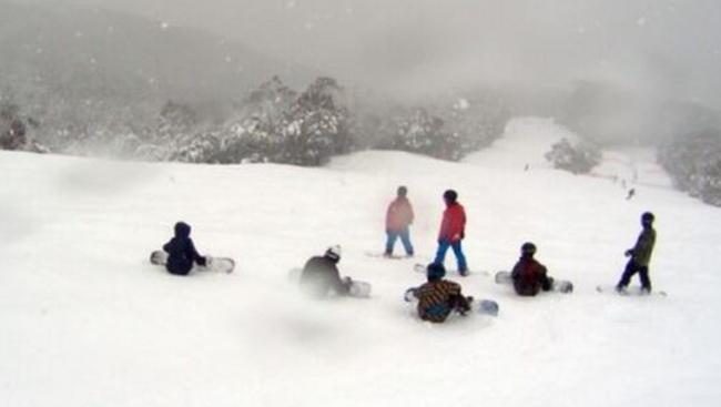 Snowboarders at Thredbo are so excited about today’s snowfalls, they’re sitting around acting too cool to snowboard.