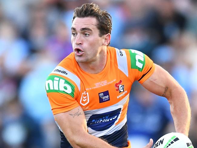 BRISBANE, AUSTRALIA - AUGUST 15:  Connor Watson of the Knights runs the ball during the round 22 NRL match between the Cronulla Sharks and the Newcastle Knights at Moreton Daily Stadium, on August 15, 2021, in Brisbane, Australia. (Photo by Albert Perez/Getty Images)