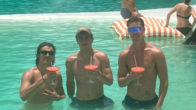 Collingwood forward Jack Ginnivan, left, is in Bali after saluting in the grand final.