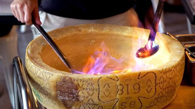 Flaming Cheese Wheel at Salt Meats Cheese Surfers Paradise.