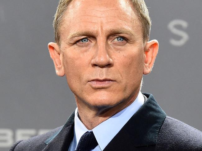 (FILES) In this file photo taken on October 28, 2015 British actor Daniel Craig poses for photographers at a photocall for the new James Bond film 'Spectre' in Berlin. - New James Bond footage from historic Hollywood studio MGM shook and stirred the movie theater industry's CinemaCon summit in Las Vegas August 24, 2021, as executives struck a defiant note about the future of the big screen. (Photo by TOBIAS SCHWARZ / AFP)