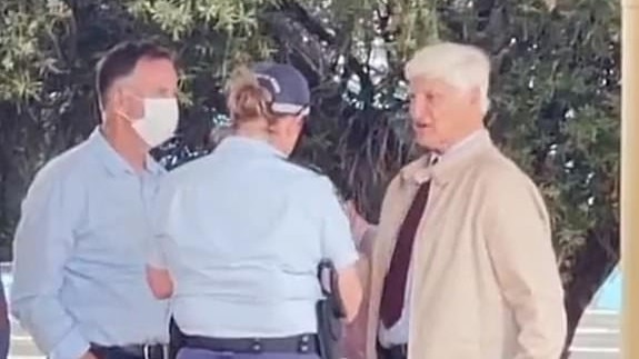 Federal MP Bob Katter speaks with police after being refused entry. Picture: Channel 7