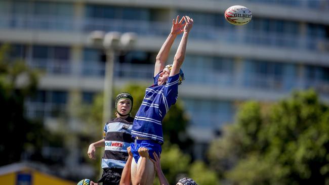 Day One of King of the Country rugby tournament at James Overell Park, Southport. Maroochydore Swans U14s' ( big stripes - blue) in action against USQ Saints U14s' (darker blue small stripes). USQ Saints U14s' Xavier Austin. Picture: Jerad Williams