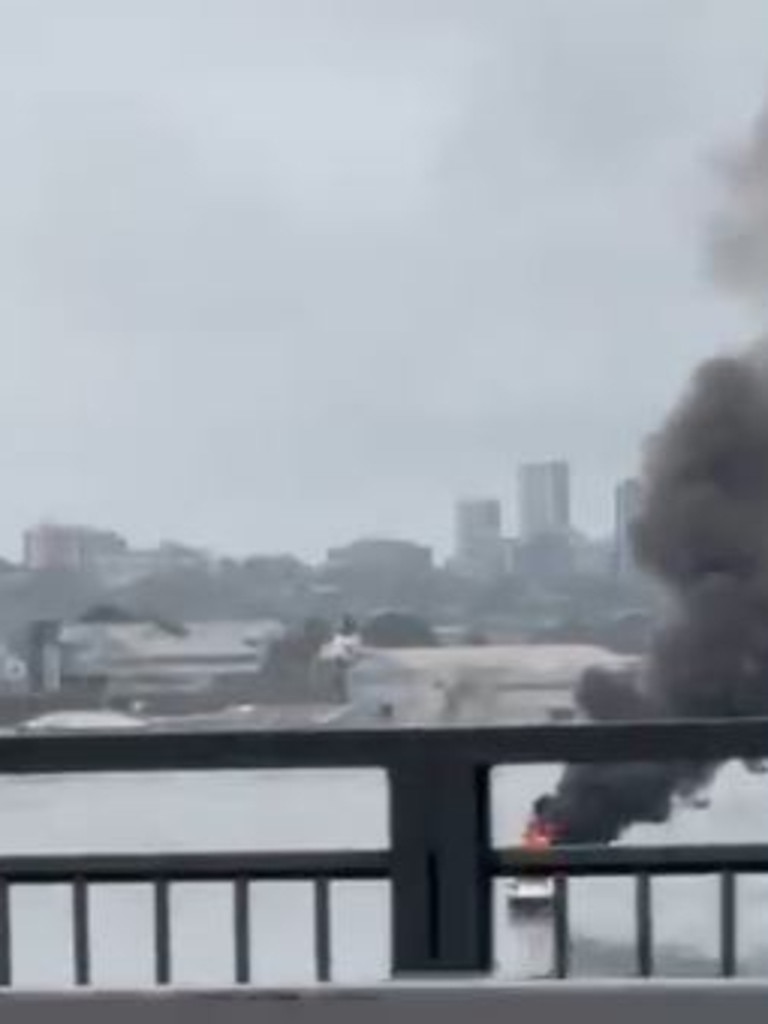 A boat caught on fire under the Iron Cove bridge.