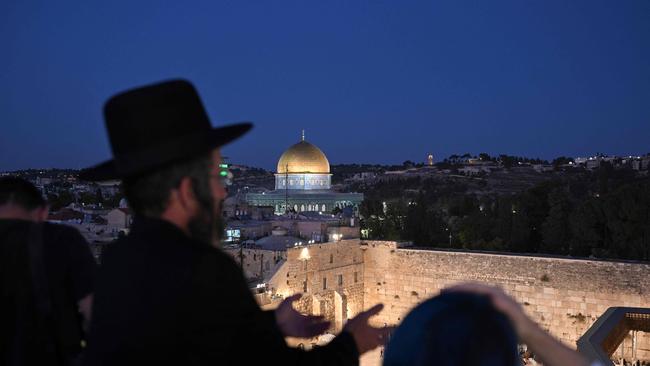 A Jewish man prays at a spot overlooking the Western Wall plaza.