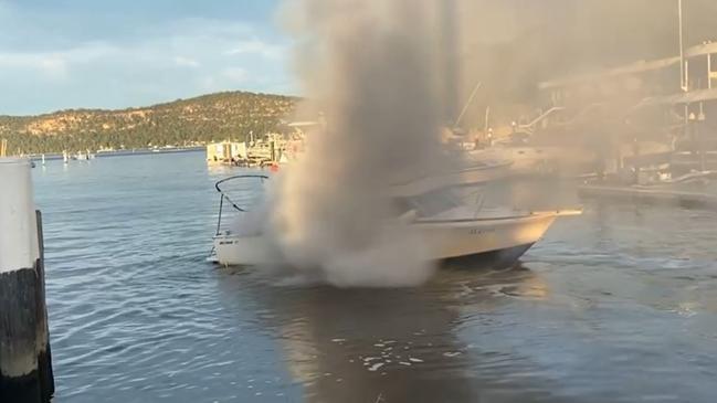 The boat already up in flames at the Hawkesbury Marina. Pictures: Greg Manning