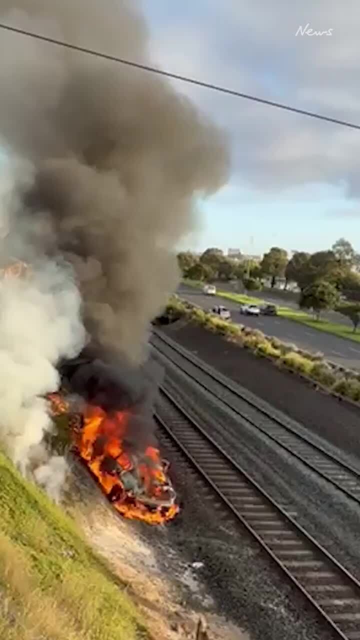 Car fire on train tracks near North Geelong