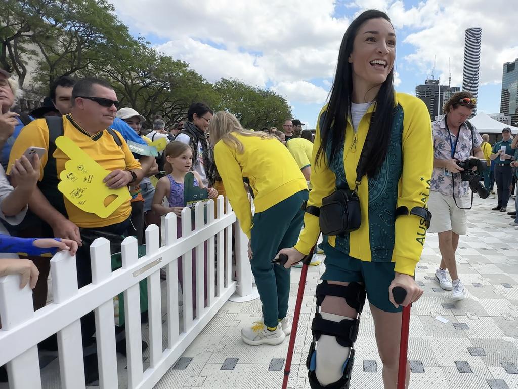 Michelle Jenneke on crutches at the Olympic welcome home parade in Brisbane. Picture: Lucas Salvatori