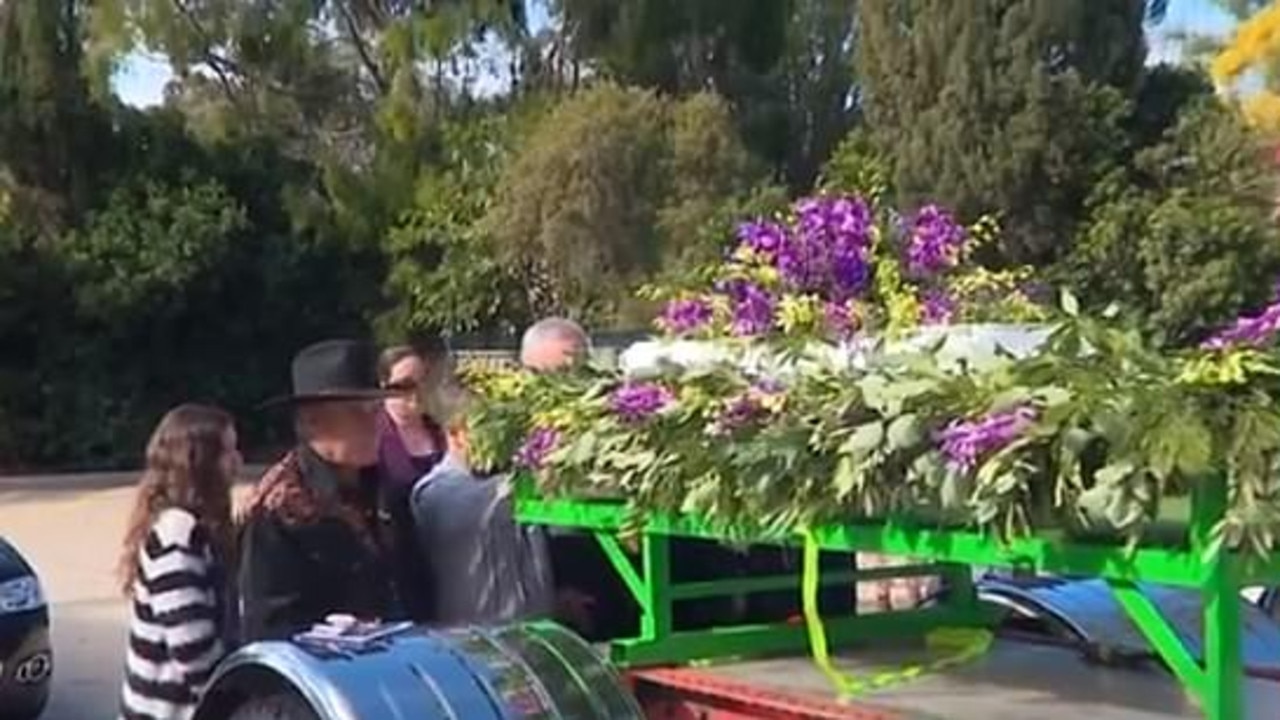 Harrison 'Harry' Sproule's casket was taken to the cemetery on a Kenworth truck.