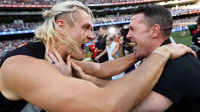 MELBOURNE, AUSTRALIA - SEPTEMBER 30: Darcy Moore of the Magpies and Craig McRae, Senior Coach of the Magpies celebrate during the 2023 AFL Grand Final match between the Collingwood Magpies and the Brisbane Lions at the Melbourne Cricket Ground on September 30, 2023 in Melbourne, Australia. (Photo by Michael Willson/AFL Photos via Getty Images)