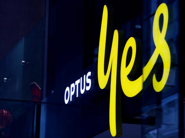 SYDNEY, AUSTRALIA - NOVEMBER 21: The Optus company sign and logo are displayed in a store window in the CBD on November 21, 2023 in Sydney, Australia. Optus' CEO Kelly Bayer Rosmarin stepped down on Monday after an extended outage last week caused millions of Australians to be disconnected from the network, with no access to emergency numbers for hours. The outage followed a hack that saw millions of customers' data shared online last year. (Photo by Lisa Maree Williams/Getty Images)