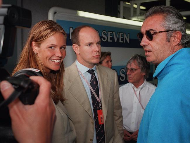 Prince Albert and Elle Macpherson at the Australian Grand Prix in 1997. Picture: AFP