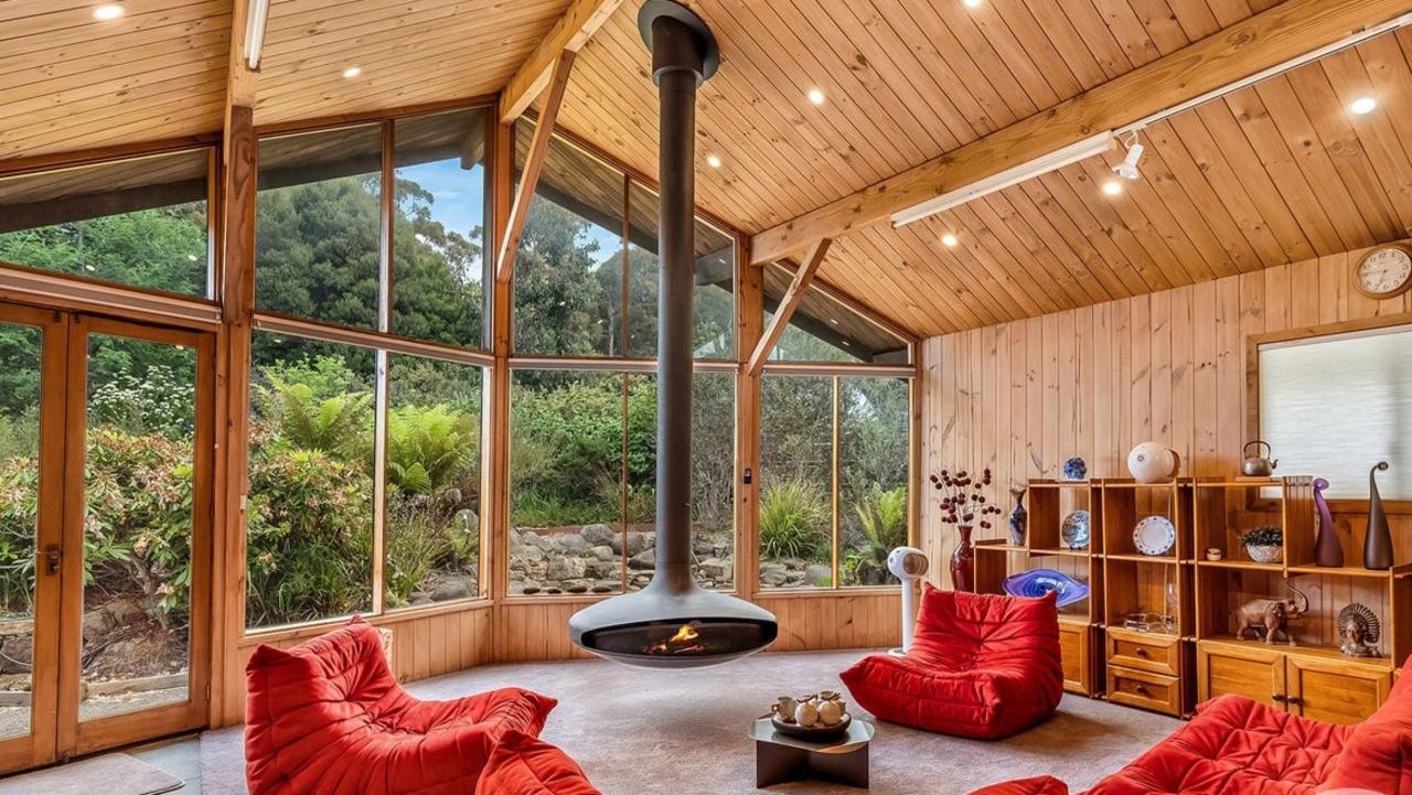 The master suite features a fire place suspended from the roof.