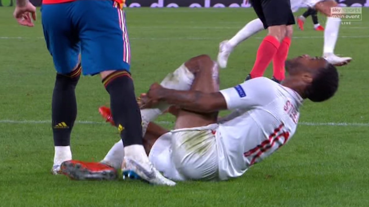 England's two-goal hero was left writhing in pain after the apparent stamp.