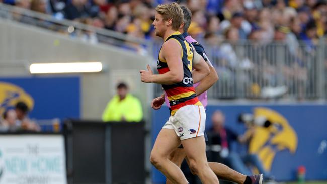 Rory Sloane of the Crows leaves the field with an eye injury during the Round 21 match against the Eagles. Picture: AAP Image/Richard Wainwright