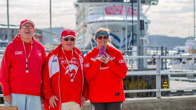 Sydney swans fans Garyth Christensen, Darrell Foxley and Katie Lofthouse who travelled to Hobart on board the first ever Sydney Swans member cruise. Picture: Linda Higginson