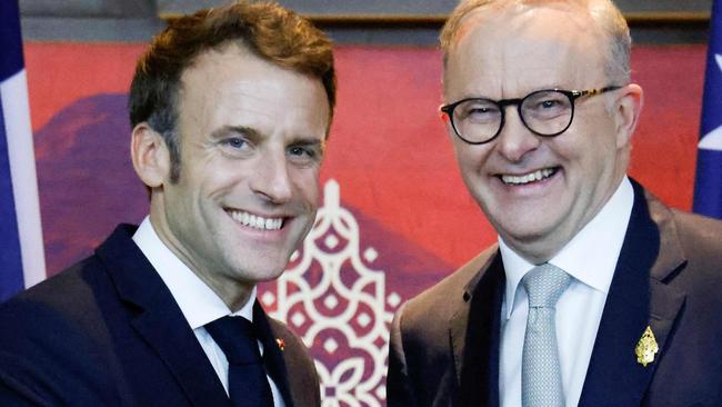 France's President Emmanuel Macron (L) meets Australia's Prime Minister Anthony Albanese on the sidelines of the G20 Summit in Nusa Dua on the Indonesian resort island of Bali on November 16, 2022. (Photo by Ludovic MARIN / POOL / AFP)