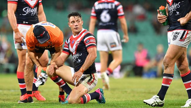 Cooper Cronk is treated by medical staff after Tevita Pangai Jr’s late hit. Picture: AAP