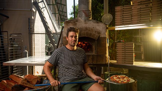 Lucky Bat cafe owner Danny Crichton says the NT Government's plan to fill the Federal Government's $130bn JobKeeper payment gaps is a great idea, but he applied for the survival fund and has heard nothing. He is anxious about when the money will flow. Picture: Che Chorley